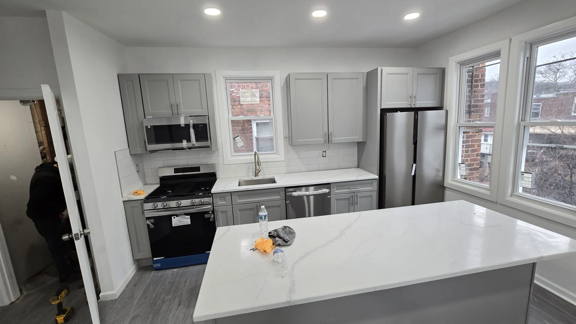 Completed Kitchen — Gray Cabinets & Quartz Island