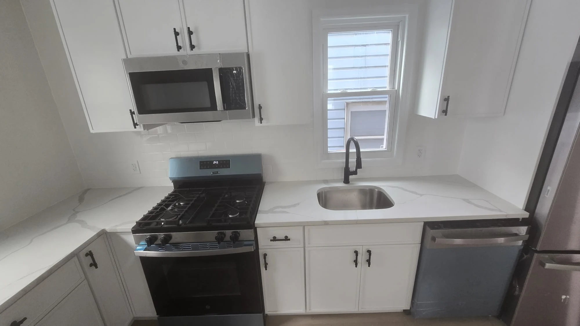 Completed Kitchen — Quartz Countertop & Gas Range