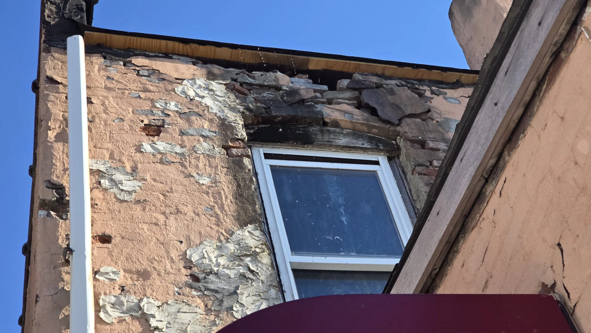 Exterior facade inspection, peeling paint and masonry