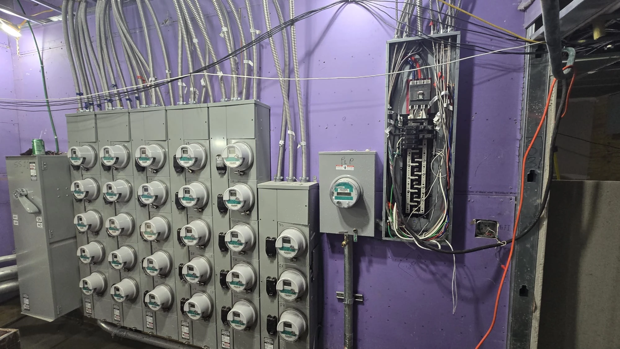 Electrical inspection - multi-unit electric meter bank and open panel