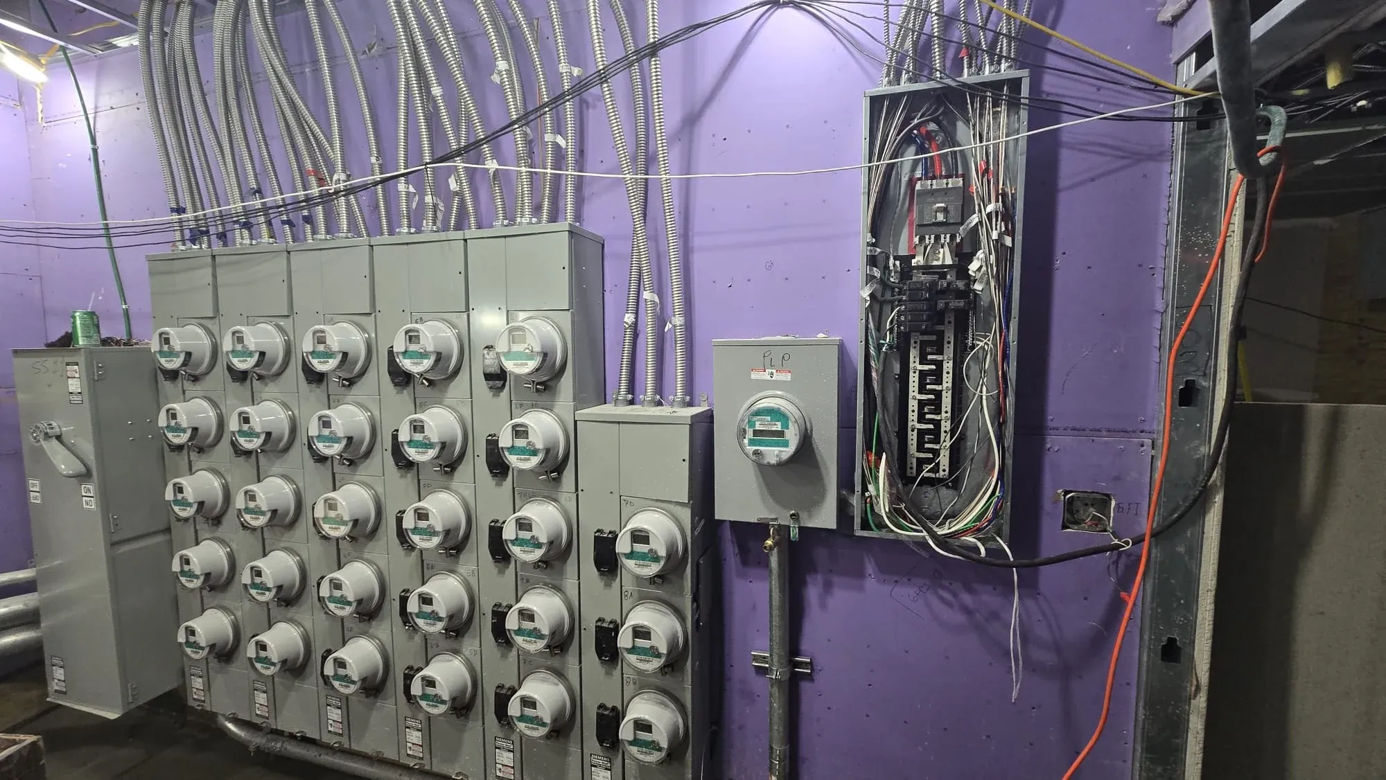 Electrical inspection - multi-unit electric meter bank and open panel
