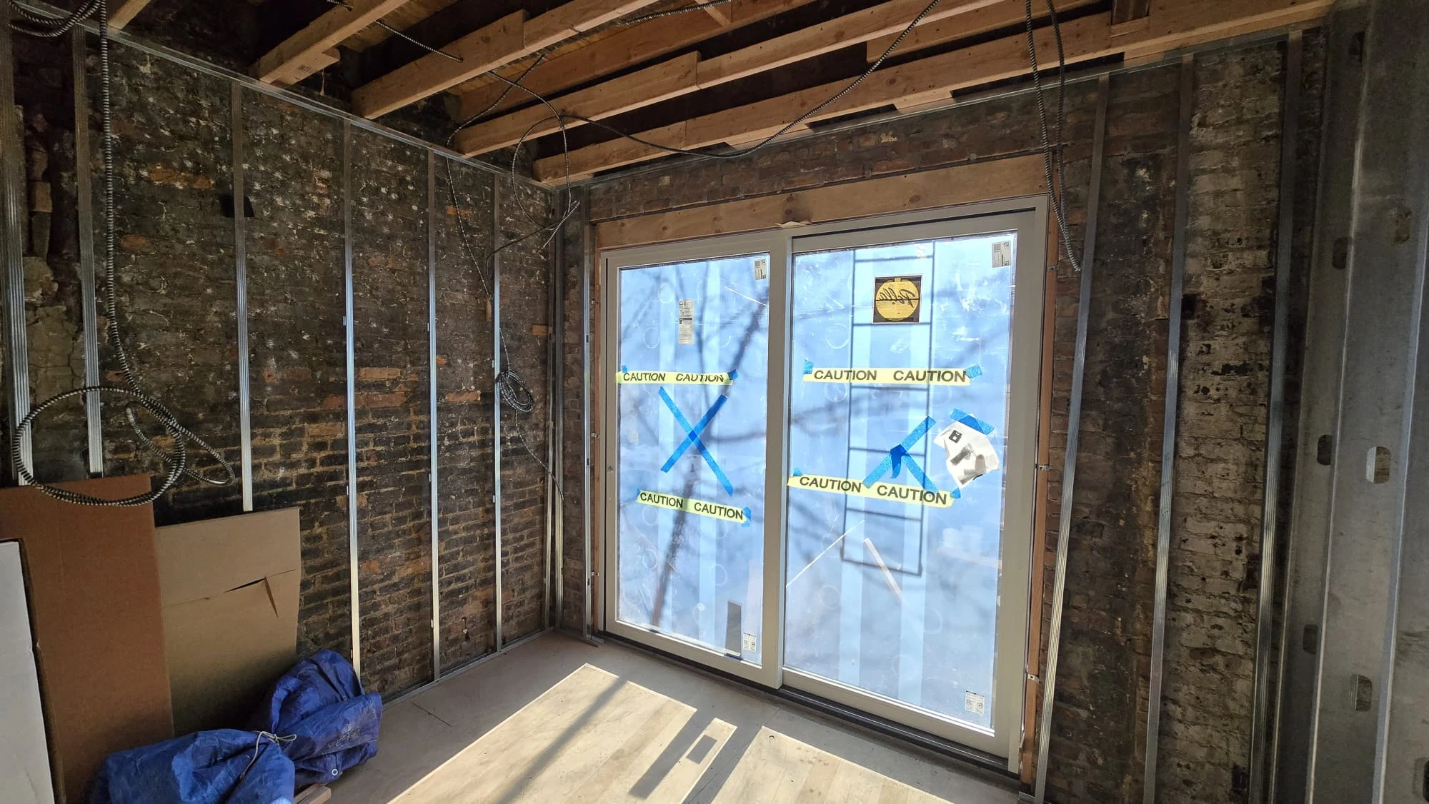 New Construction — Sliding Doors & Brick Interior