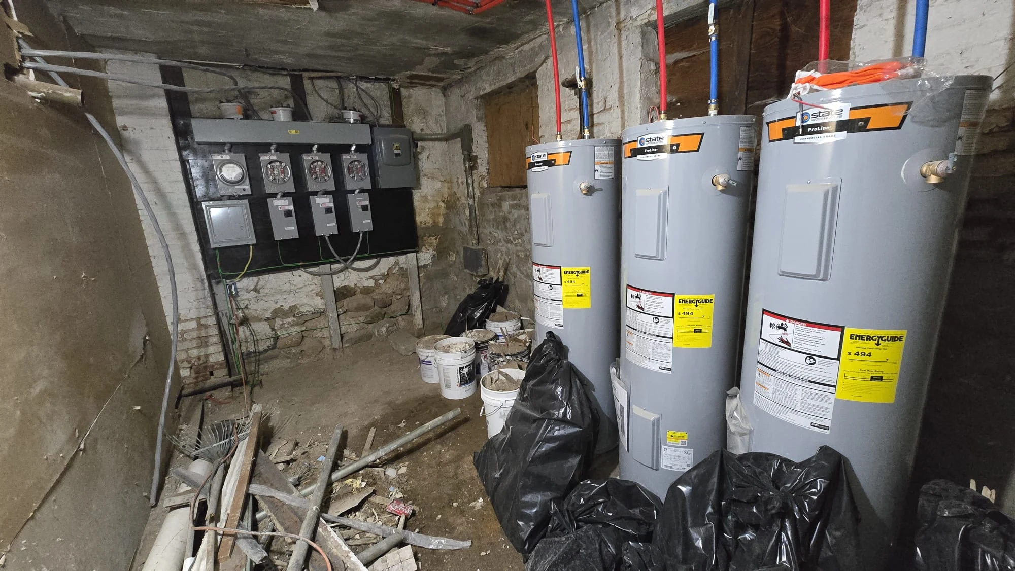 Three Water Heaters & Electrical Meters — Basement